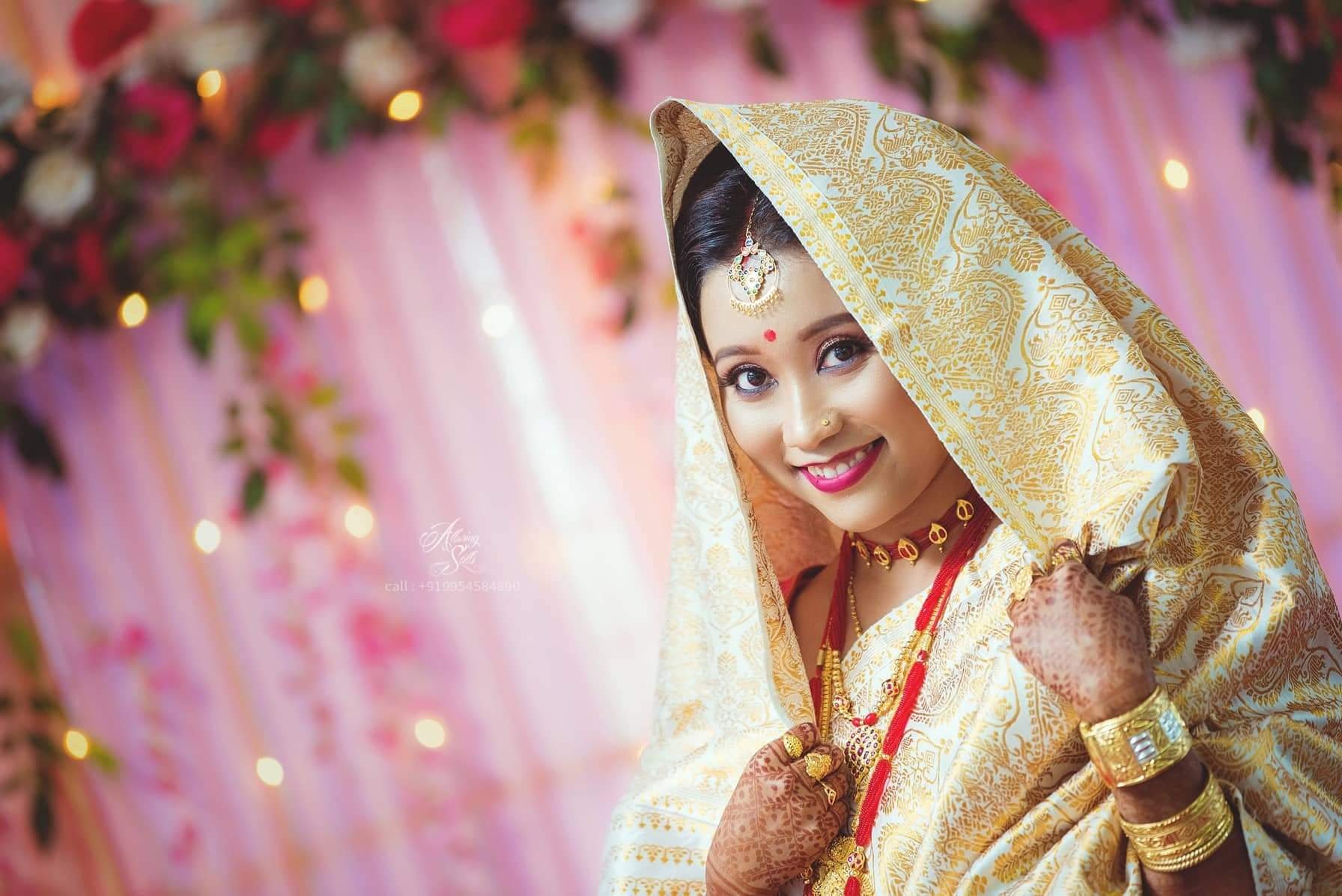 Assamese bride flaunting the ceremonial white paat mekhela chador